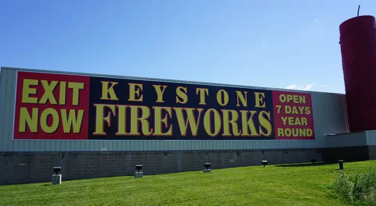 Large yellow and red Keystone sign on the side of the building