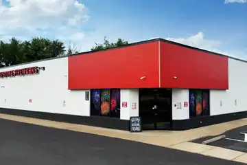 Keystone Cranberry building with a red front and parking lot